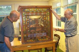 Uncrating of newly restored Harry Horwood stained glass windows
