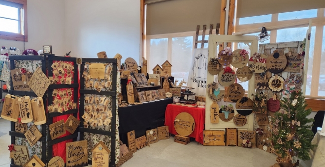 Vendor booth of handmade burned wood signs