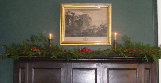 The parlour mantle all decorated with greenery for the holidays