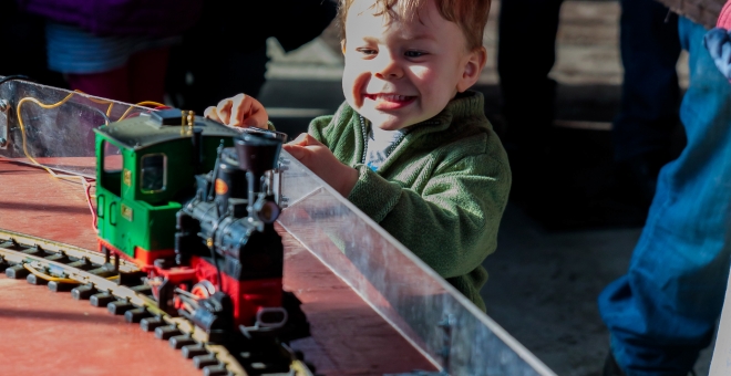 Model Train with happy child, Steam Museum, National HIstoric Site