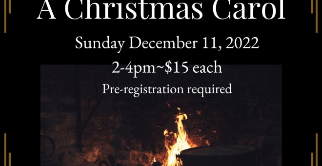 A fire glows at the annual Christmas Carol